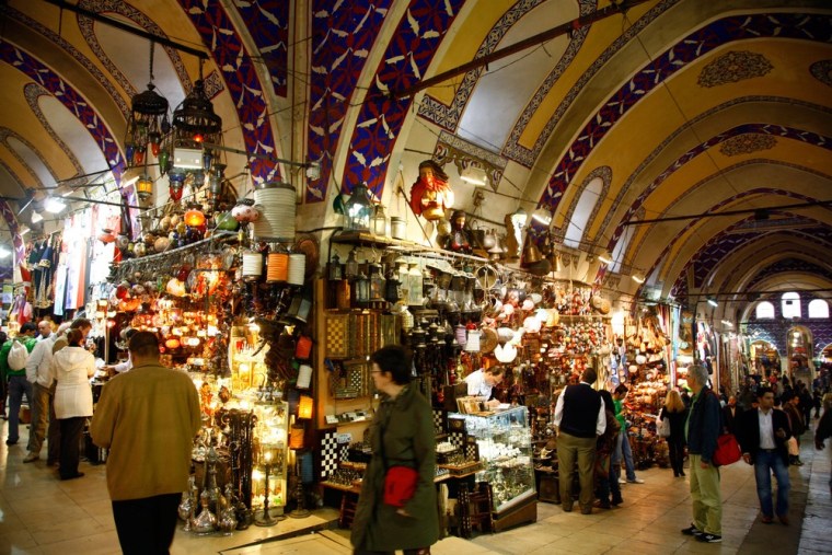 Hand-painted ceramics, lanterns, intricately patterned carpets, copperware, gold Byzantine-style jewelry and other goods are on display within the Grand Bazaar's vaulted walkways in Istanbul.